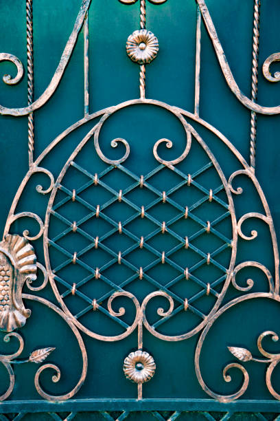 istock magnificent wrought-iron gates, ornamental forging, forged elements close-up 868641128