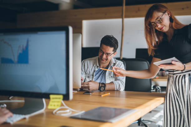istock Coworkers working together in the office 868643354