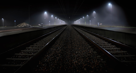 Railroad station in night gives a mystic feeling
