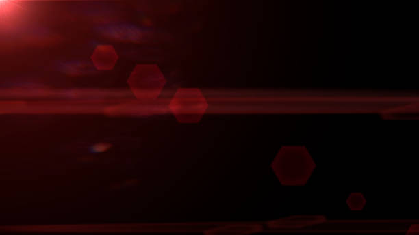 istock red and mainly off screen lens flare overlay texture with hexagon bokeh effect in front of a black background 868647948