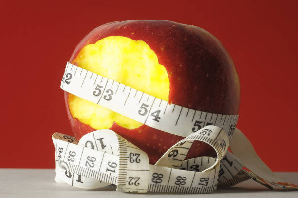 dieta mela e metro - spartan apple foto e immagini stock