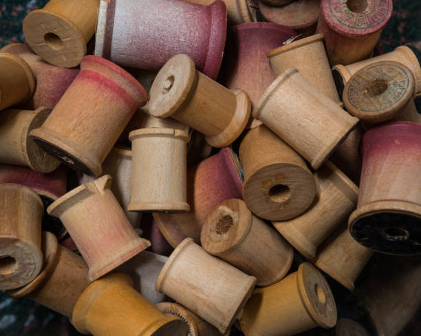 istock Pile of Antique Wooden Spools 868659128