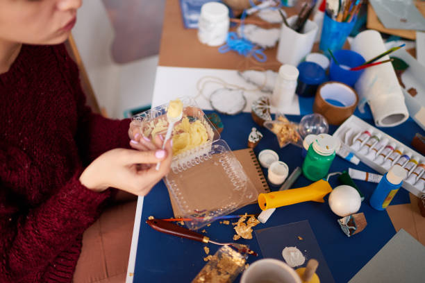 istock Craftswoman having snack at workplace 868659160