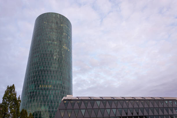 istock The Westhafen tower at the river Main in Frankfurt with clouds 868659422