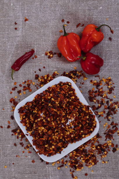 istock Dried and fresh chili on linen 868663162