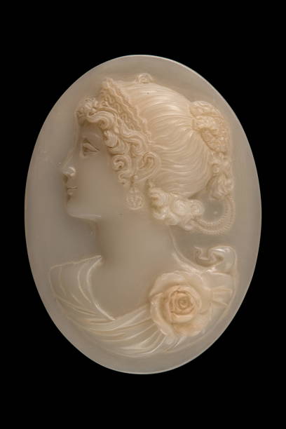faccia di plastica in un medaglione su sfondo nero - brooch jewelry antique gem foto e immagini stock