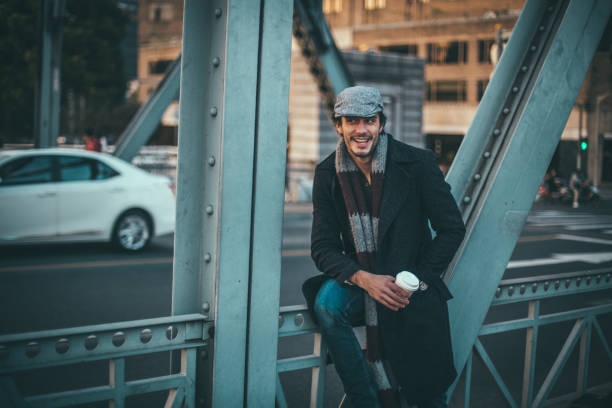 istock Handsome man drinking coffee outdoors 868665992