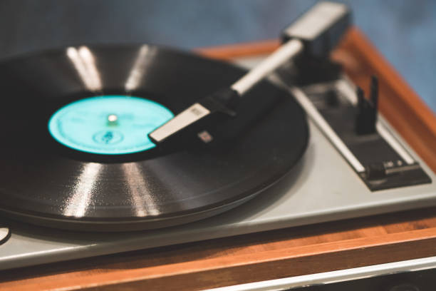 istock Vintage record player with vinyl disc, close-up. 868669200