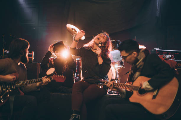 istock Rock band playing in club 868669360