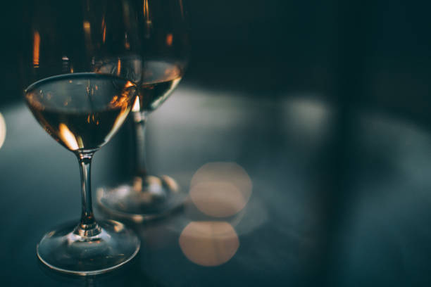 istock Two glasses of white wine on a table 868669398