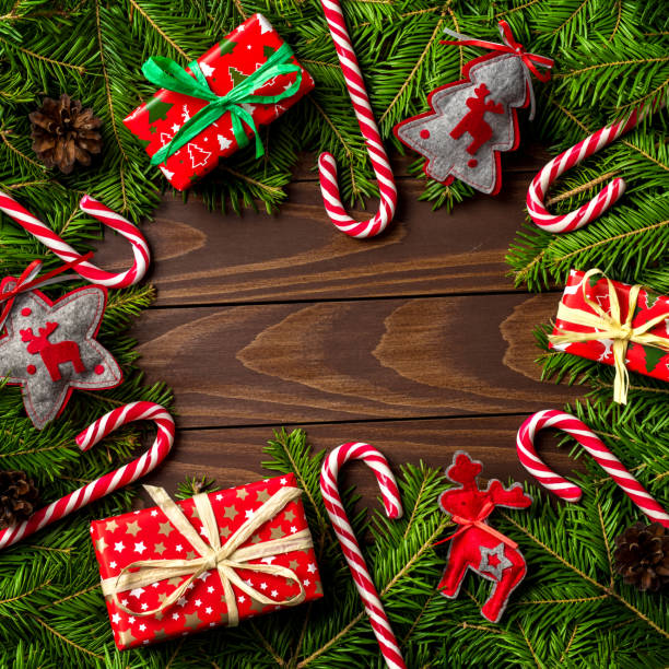istock Christmas background with colorful gift boxes, decorations and candy canes with copy space 868669610