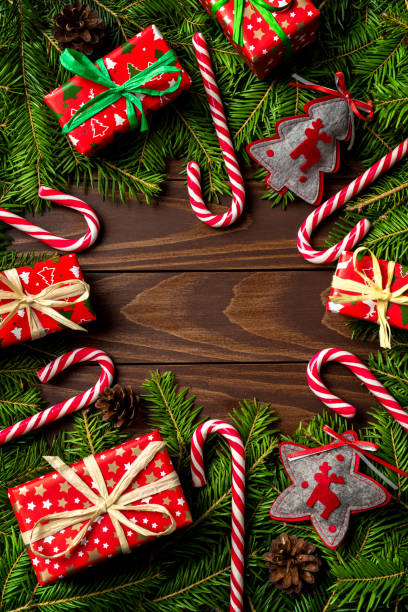 istock Christmas background with colorful gift boxes, decorations and candy canes with copy space 868670466