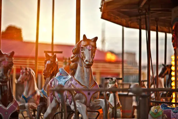Photo of Multicolored horses on a carousel