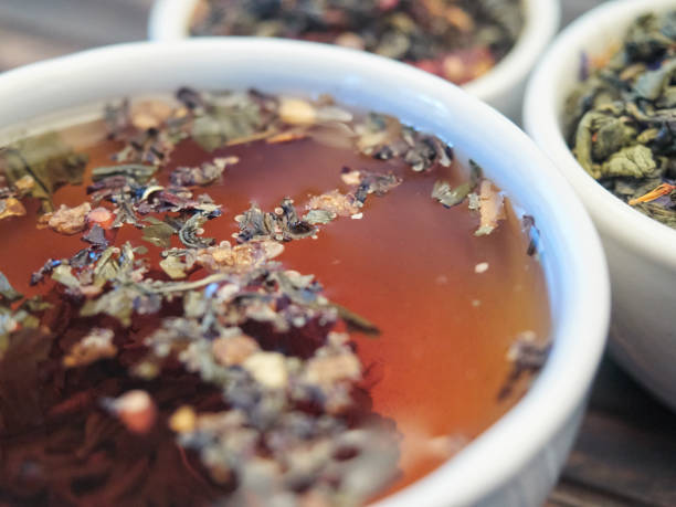 Tea of different kinds is poured into light cups.