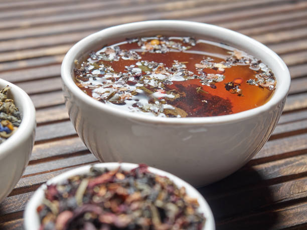 istock Tea of different kinds is poured into light cups. 868679550