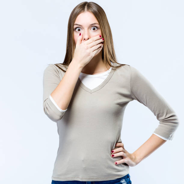 istock Beautiful woman surprised over white background. 868679634