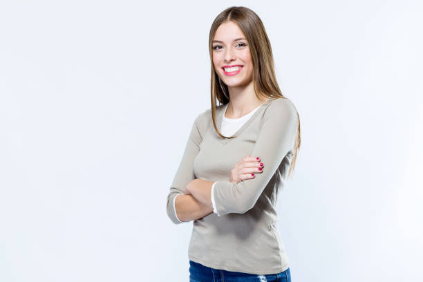 istock Beautiful young woman looking at camera over white background. 868682014