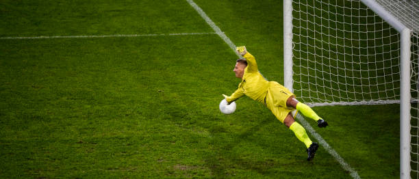 istock Goalie defending goal 868684262