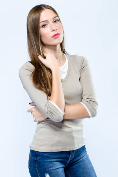 istock Beautiful young woman looking at camera over white background. 868684326