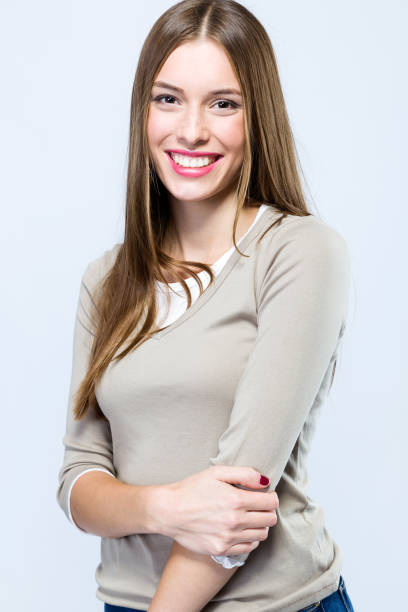 istock Beautiful young woman looking at camera over white background. 868685478