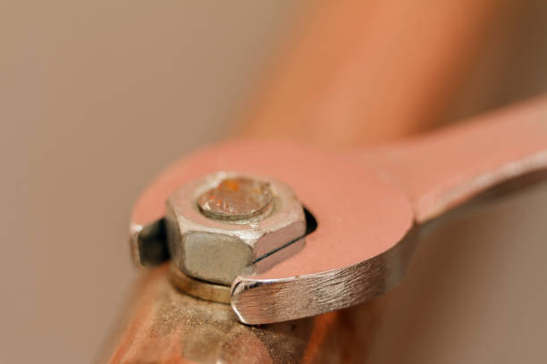 istock Metal nut And Chrome-Vanadium Spanner Gripping Isolated On blurred Background 868685956