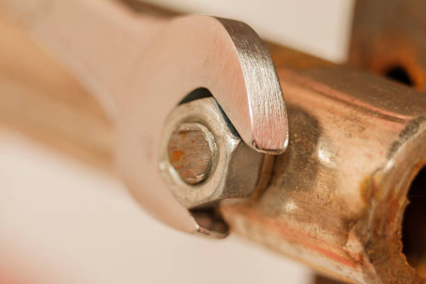 istock Metal nut And Chrome-Vanadium Spanner Gripping Isolated On blurred Background 868688144