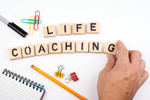 life coaching. Wooden letters on a white background stock photo