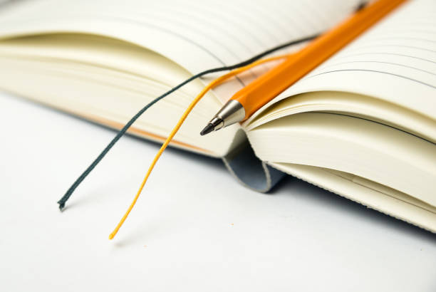 istock Diary and mecanic pencil on over white 868697844