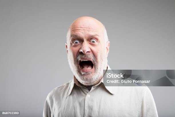 Strong Exaggerated Fear Expression Of An Old Man Stock Photo - Download Image Now - Fear, Terrified, Human Face