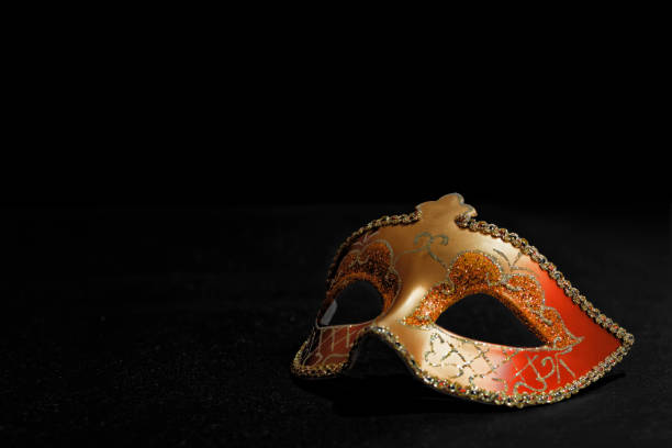istock Golden Mardi Gras or Carnival mask isolated on a black background. 868702466