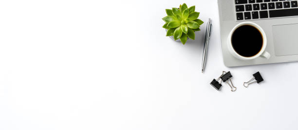 istock Modern laptop and business accessories isolated on white background. Office desktop with copyspace 868704842