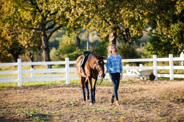 istock Beautiful girl with horse 868707332