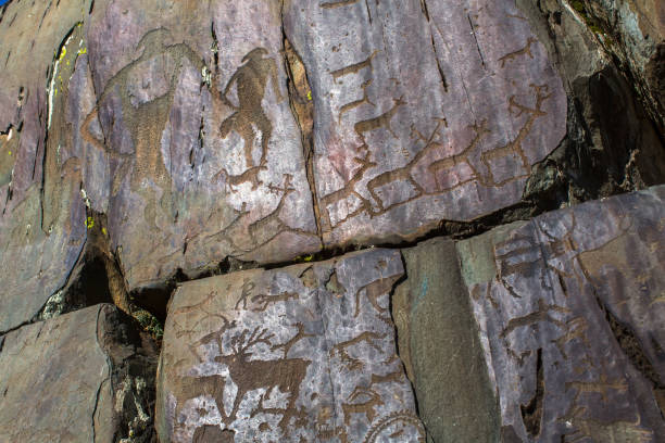 Petroglyphs. Ancient rock paintings in the Altai Mountains, Russia. Petroglyphs. Ancient rock paintings in the Altai Mountains, Russia. çatalhöyük stock pictures, royalty-free photos & images