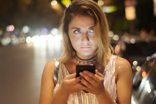 istock Pretty young woman using her phone 868714022