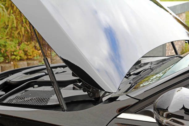 istock The engine of a black car with open bonnet. Diesel engine in a car 868714296