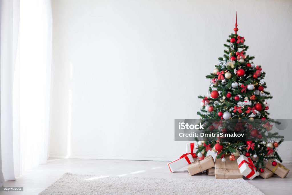 Christmas tree with red decorations new year gifts Christmas tree with red decorations new year gifts 2018 Christmas Tree Stock Photo