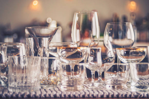 Party background with defocused bottles and empty glasses