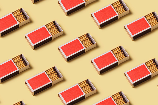 Box of matches isolated on yellow background