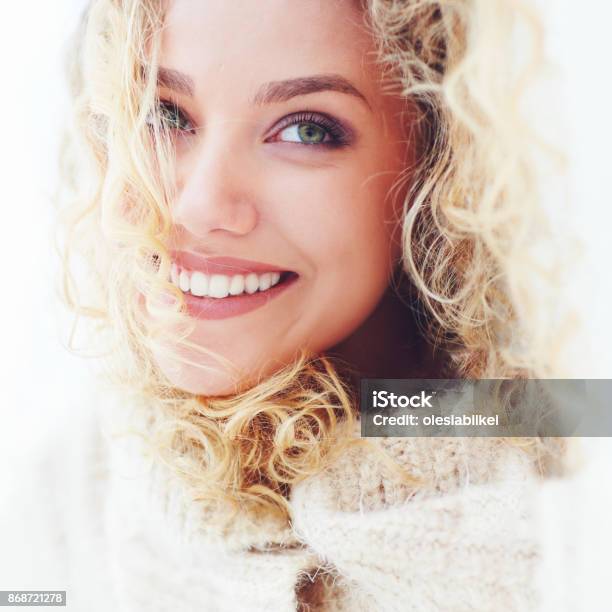 Portrait Of Beautiful Woman With Curly Hair And Adorable Smile Stock Photo - Download Image Now