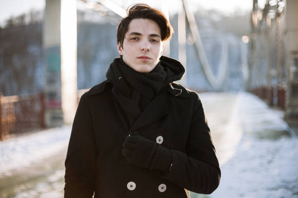 istock Portrait of a handsome guy standing on the bridge 868724878
