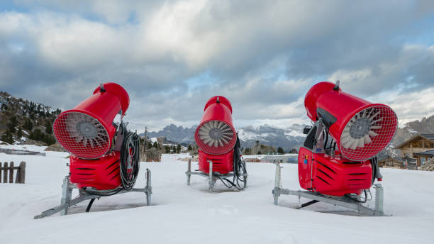 Rear view of three snow cannons in alpine ski resort