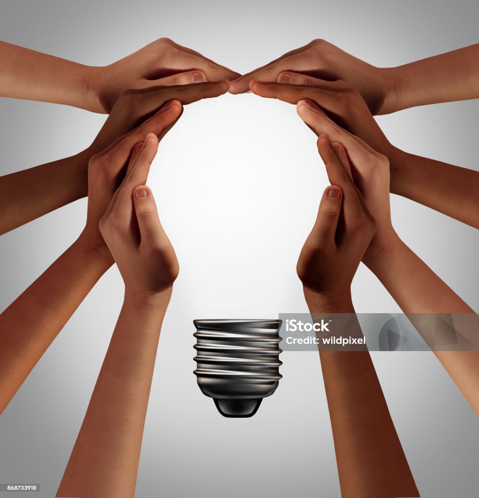 People Thinking Together People thinking together as a diverse group coming together joining hands into the shape of an inspirational light bulb as a community support metaphor with 3D elements. Community Stock Photo