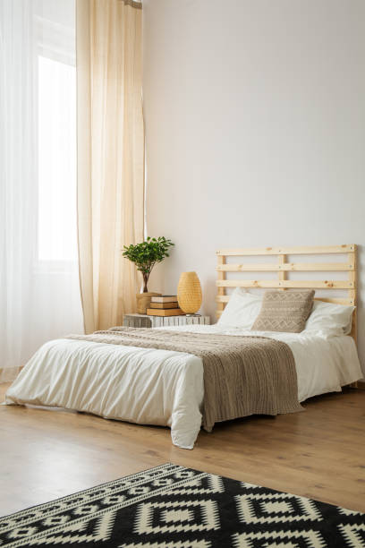 istock Beige and white minimalist bedroom 868741052