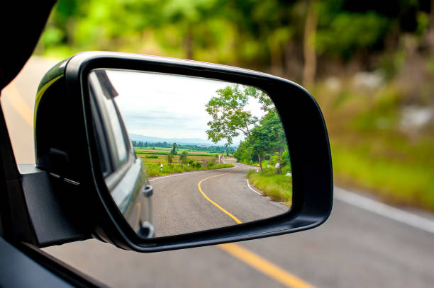 istock Landscape in the sideview mirror of a car 868744062