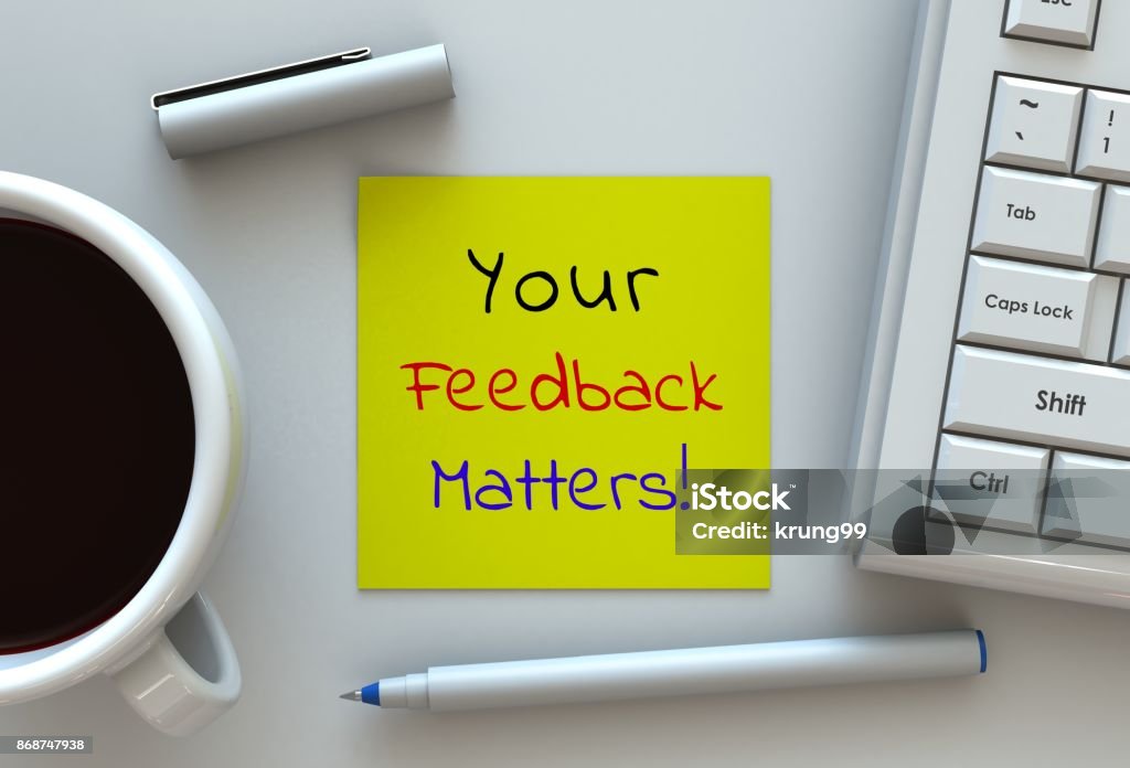 Your Feedback Matters, message on note paper, computer and coffee on table Questionnaire Stock Photo