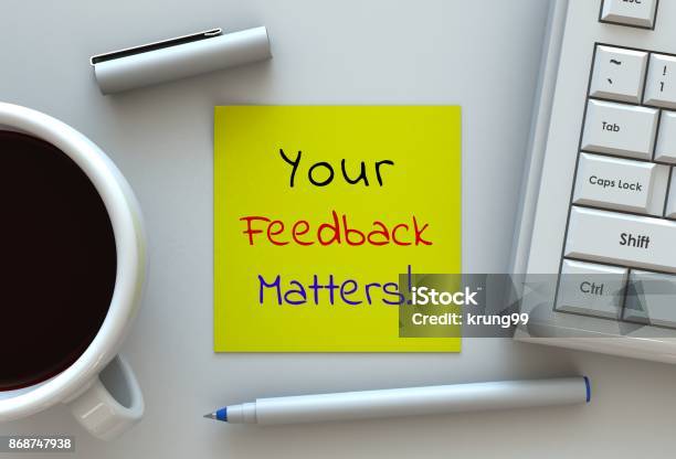 Your Feedback Matters Message On Note Paper Computer And Coffee On Table Stock Photo - Download Image Now