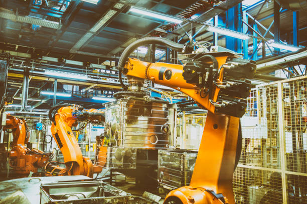 istock Robotic arm lifting up piece of technology 868748284