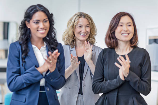 istock Multi-ethnic businesswomen applauding on a meeting 868748324