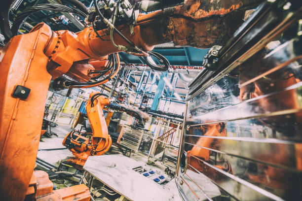 istock Close-up of robotic arm lifting metal box 868748590