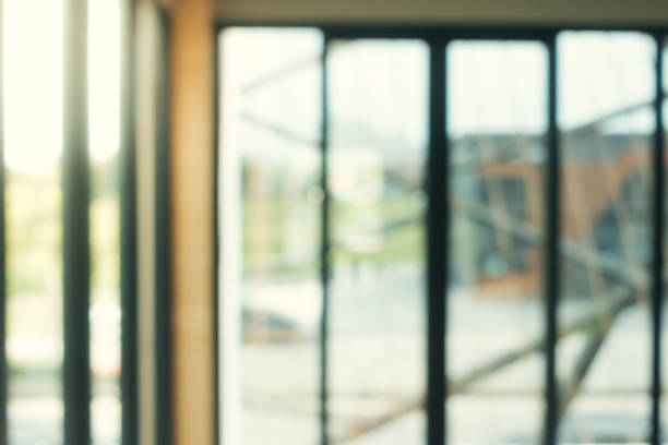 istock Blurred background - Coffee shop in building blur background with bokeh. Vintage filtered image. Panoramic banner background. 868748662